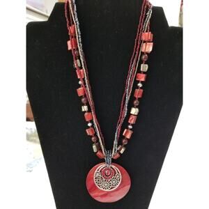 Sixteen inch red beaded necklace with 2" extension 2" pendant b93